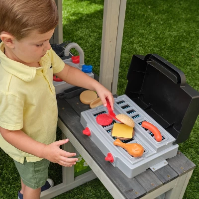 KidKraft Patio Party Wooden Outdoor Playhouse With Spinner Block Puzzle - 14pc 2 KidKraft Patio Party Wooden Outdoor Playhouse With Spinner Block Puzzle - 14pc - Image 2